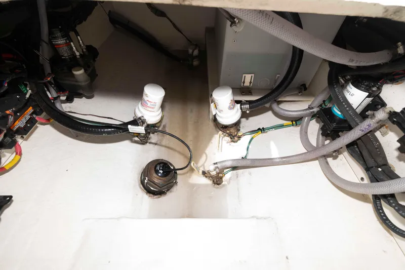 Slide: The Image of 2020 Cobia 320 Center Console boat storage compartment open on deck. - 28