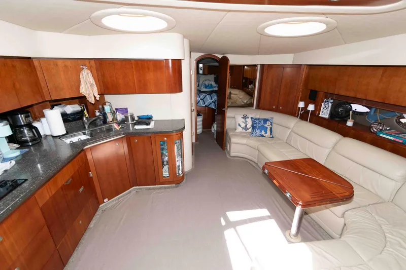 Slide: The Image of Luxurious interior of 2007 Cruisers Yachts 520 Express with kitchen and seating area. - 11