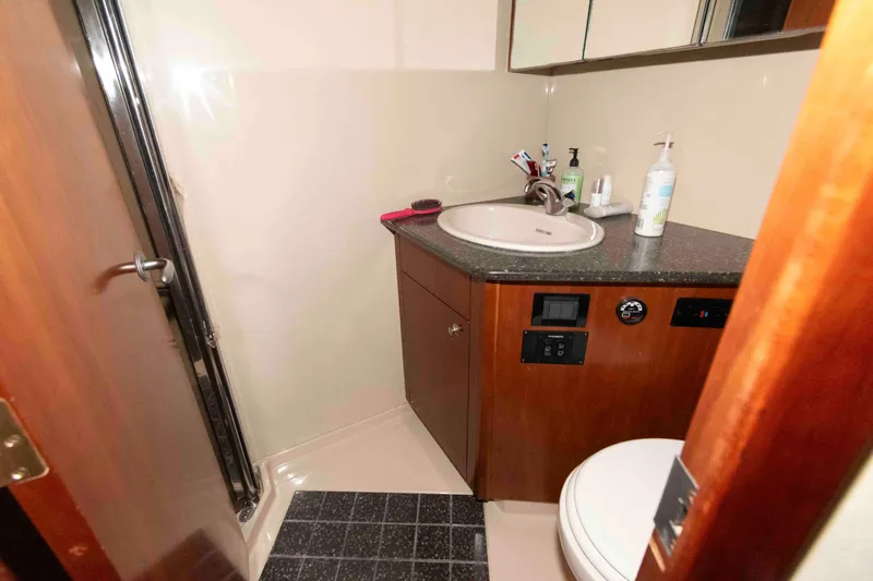 Slide: The Image of Bathroom interior of 2007 Cruisers Yachts 520 Express with sink and toilet. - 16