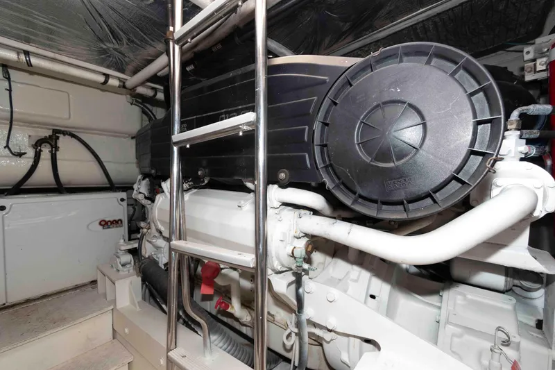 Slide: The Image of Engine room of 2007 Cruisers Yachts 520 Express with visible machinery and ladder. - 21