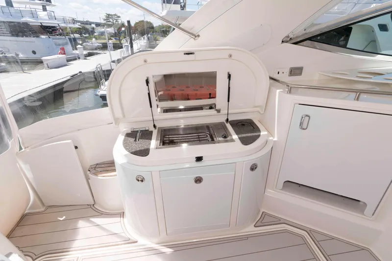 Slide: The Image of 2007 Cruisers Yachts 520 Express yacht kitchen area with grill and storage. - 8