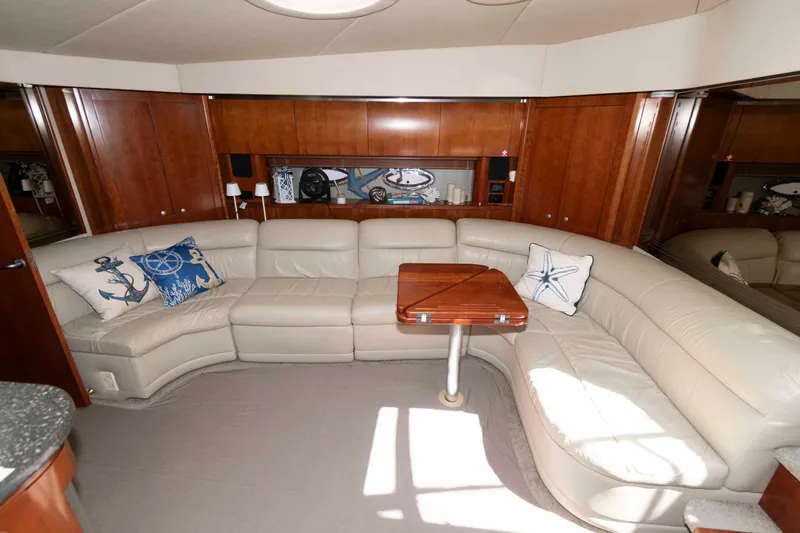 Slide: The Image of Luxurious 2007 Cruisers Yachts 520 Express interior with leather seating and nautical decor. - 12