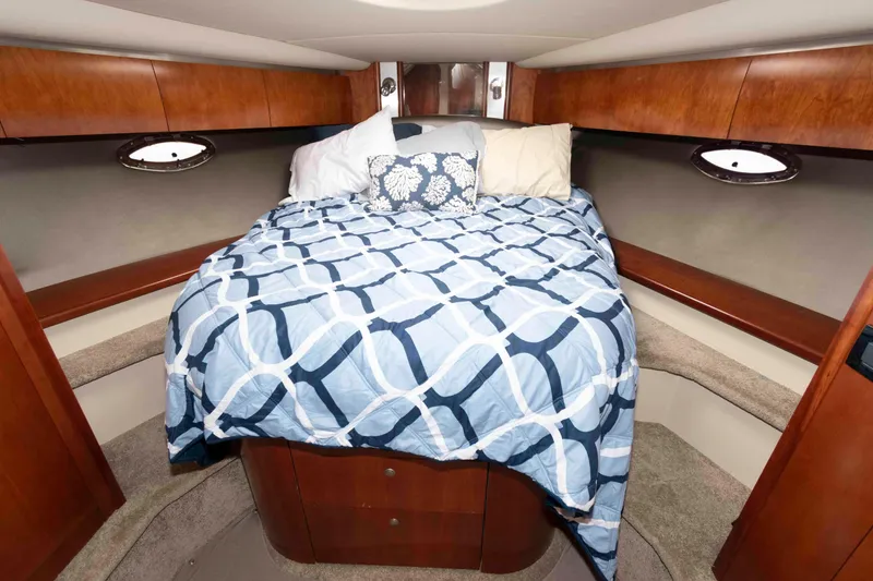 Slide: The Image of Luxurious cabin interior of 2007 Cruisers Yachts 520 Express with cozy bedding. - 17