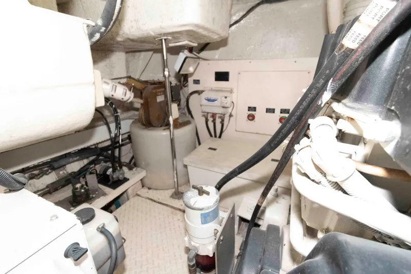 Slide: The Image of Engine room of 2007 Cruisers Yachts 520 Express, showcasing mechanical components and wiring. - 24