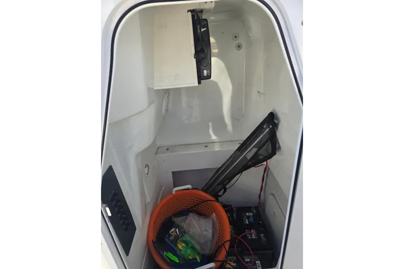 Slide: The Image of Storage compartment of a 2004 Polar 23 CC boat with equipment and supplies. - 11