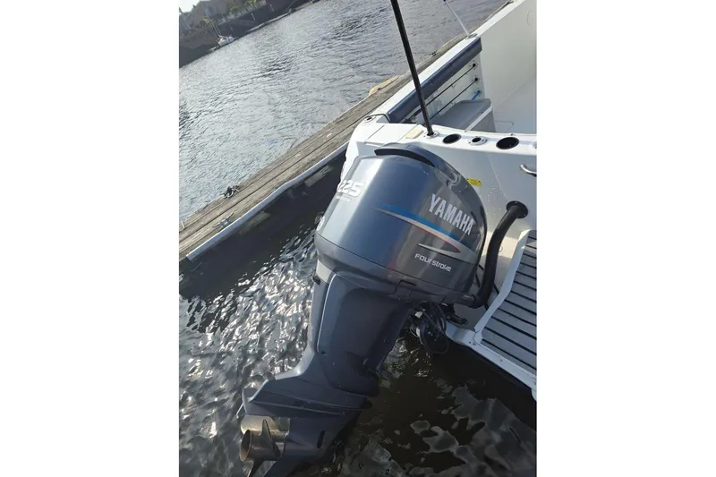 Slide: The Image of 2004 Polar 23 CC boat with Yamaha 225 outboard motor at dock. - 6