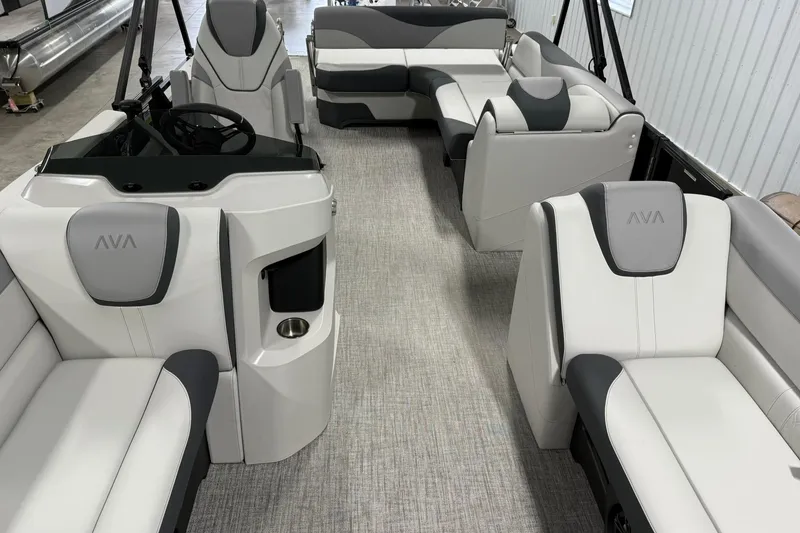 Slide: The Image of 2025 Avalon LSZ Cruise Rear Bench boat interior with modern seating and steering console. - 17