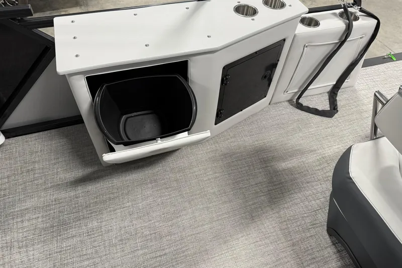 Slide: The Image of 2025 Avalon LSZ Cruise Rear Bench with storage and cup holders on a textured floor. - 20