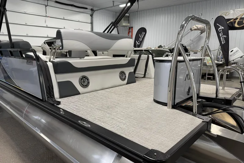 Slide: The Image of 2025 Avalon LSZ Cruise Rear Bench pontoon boat interior with modern seating and sleek design. - 6