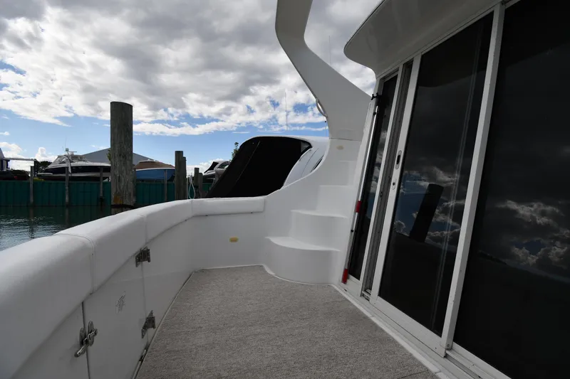Slide: The Image of 2001 Carver 350 Mariner yacht deck with stairs and sliding glass doors. - 11