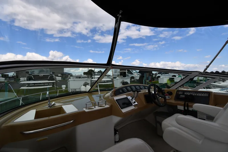 Slide: The Image of Interior view of 2001 Carver 350 Mariner yacht cockpit with steering wheel and controls. - 17