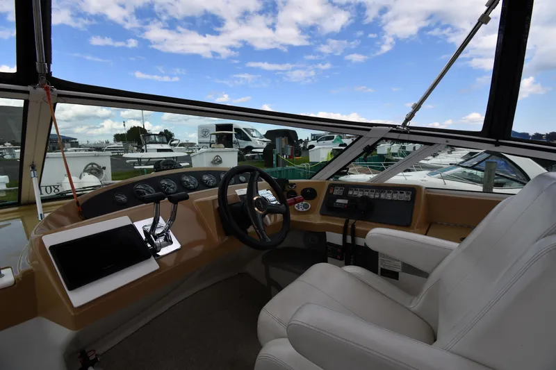 Slide: The Image of Interior view of 2001 Carver 350 Mariner boat cockpit with steering wheel and controls. - 18