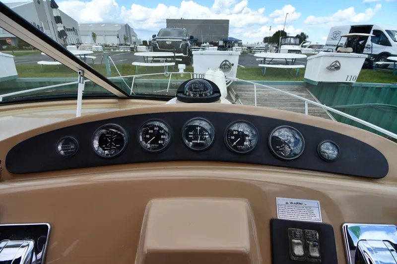 Slide: The Image of 2001 Carver 350 Mariner dashboard with gauges and controls, docked at marina. - 20