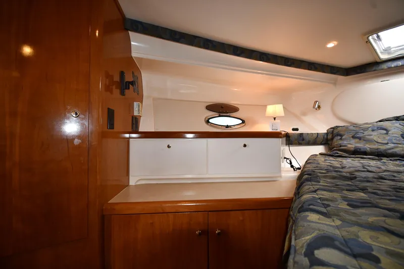 Slide: The Image of Cozy cabin interior of 2001 Carver 350 Mariner with wood cabinetry and bed. - 30