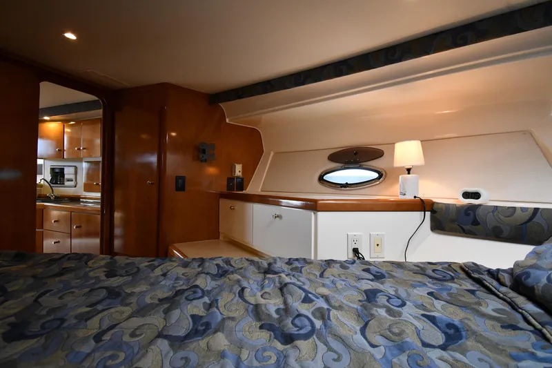 Slide: The Image of Interior of 2001 Carver 350 Mariner yacht with cozy bedroom and kitchenette. - 31