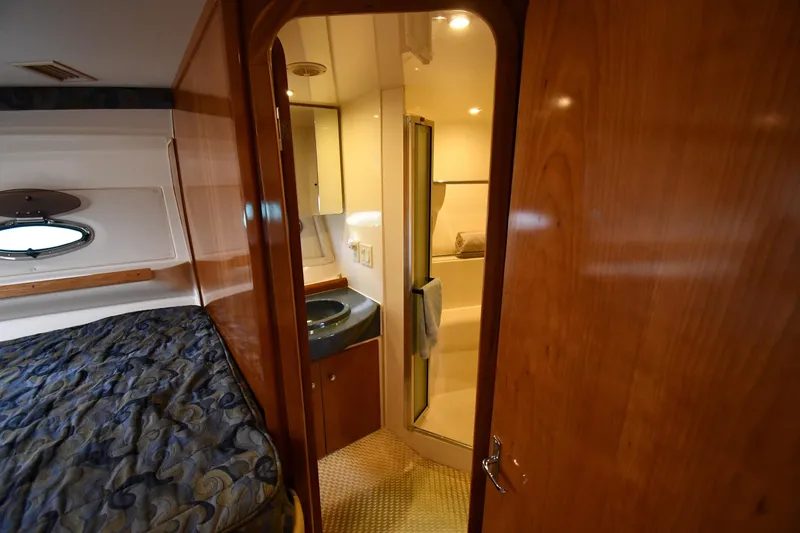 Slide: The Image of 2001 Carver 350 Mariner interior with cozy bedroom and compact bathroom. - 33