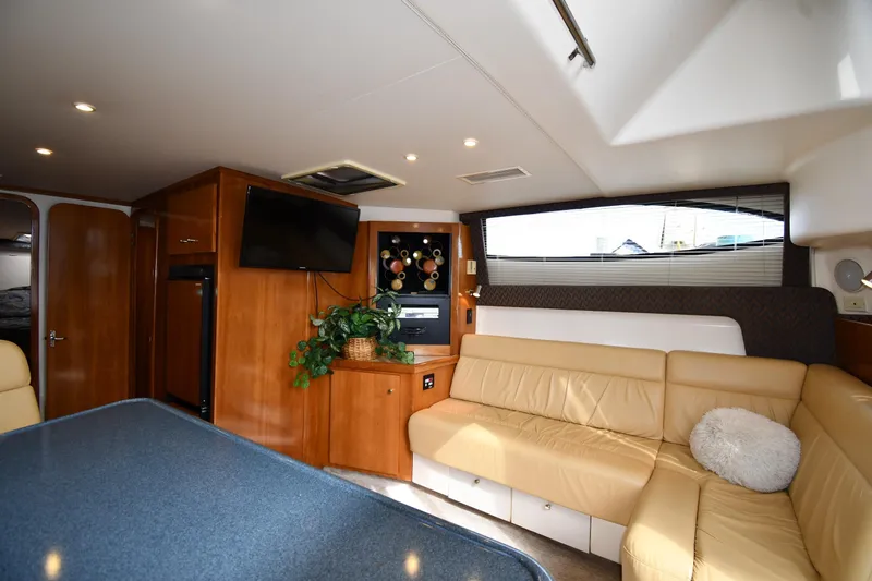 Slide: The Image of Luxurious interior of 2001 Carver 350 Mariner yacht with beige seating and modern amenities. - 37