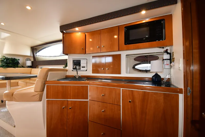 Slide: The Image of Interior of 2001 Carver 350 Mariner yacht with wood cabinetry and modern amenities. - 42