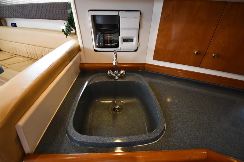 Slide: The Image of 2001 Carver 350 Mariner yacht kitchen with sink and built-in coffee maker. - 44
