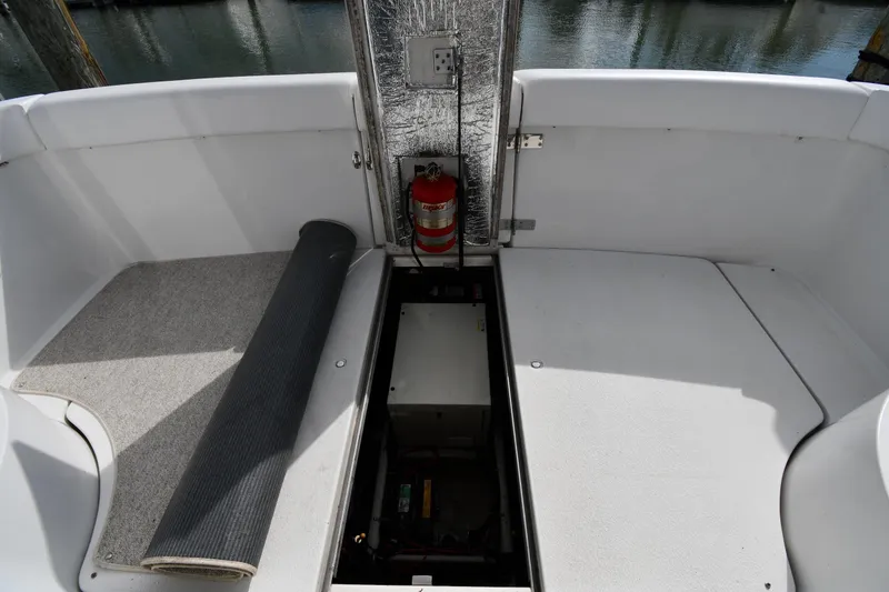 Slide: The Image of 2001 Carver 350 Mariner boat interior with open hatch and fire extinguisher. - 48