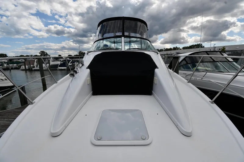 Slide: The Image of 2001 Carver 350 Mariner yacht docked at marina under cloudy sky. - 5