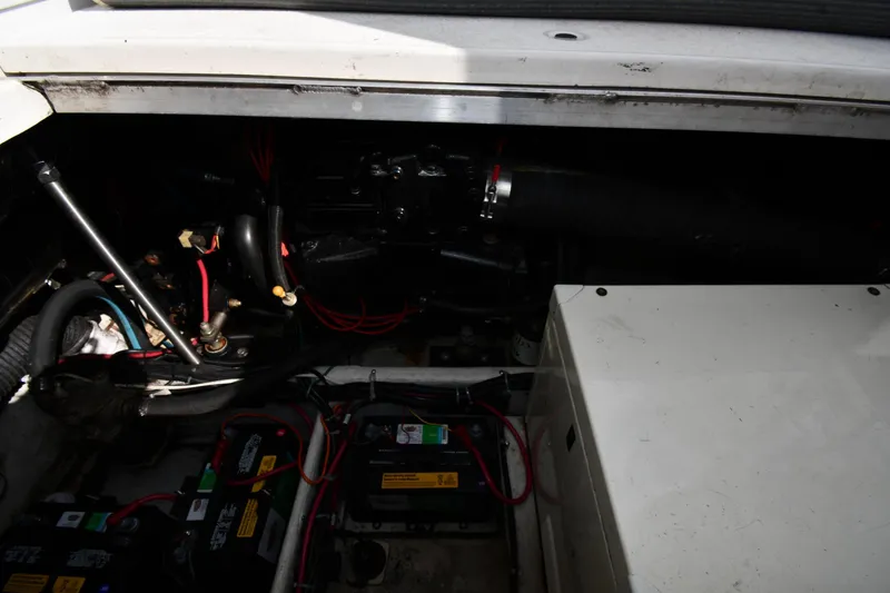 Slide: The Image of Engine compartment of a 2001 Carver 350 Mariner with visible wiring and components. - 50
