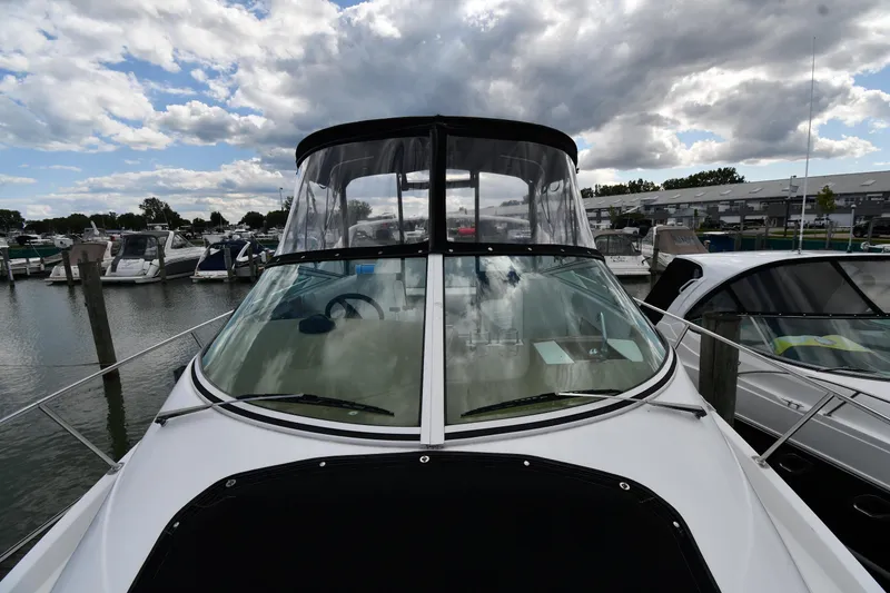 Slide: The Image of 2001 Carver 350 Mariner yacht docked at marina under cloudy sky. - 6