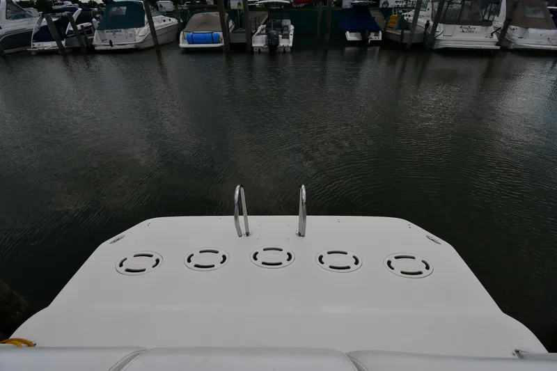 Slide: The Image of 2001 Carver 350 Mariner boat docked at marina with other vessels. - 9