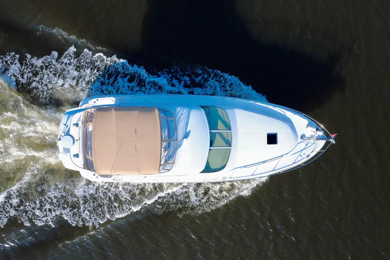 Slide: The Image of Aerial view of 2003 Sea Ray 400 Sedan Bridge yacht cruising on water. - 15