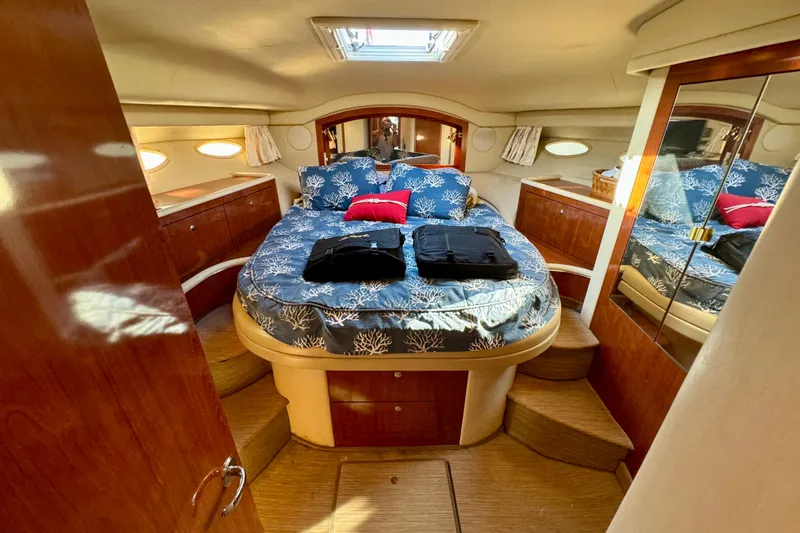 Slide: The Image of Luxurious cabin interior of 2003 Sea Ray 400 Sedan Bridge yacht with elegant bedding. - 2