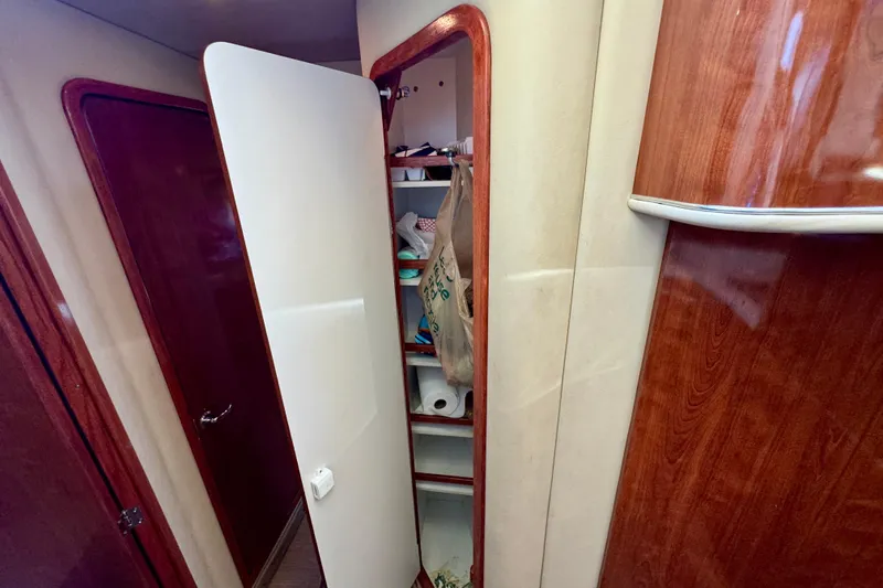 Slide: The Image of Interior storage cabinet on a 2003 Sea Ray 400 Sedan Bridge yacht. - 37