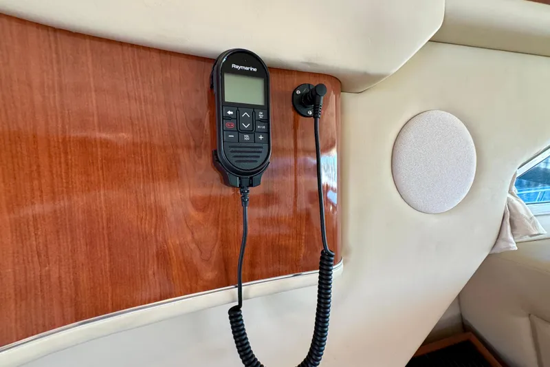 Slide: The Image of Raymarine radio on 2003 Sea Ray 400 Sedan Bridge yacht's wooden interior panel. - 41