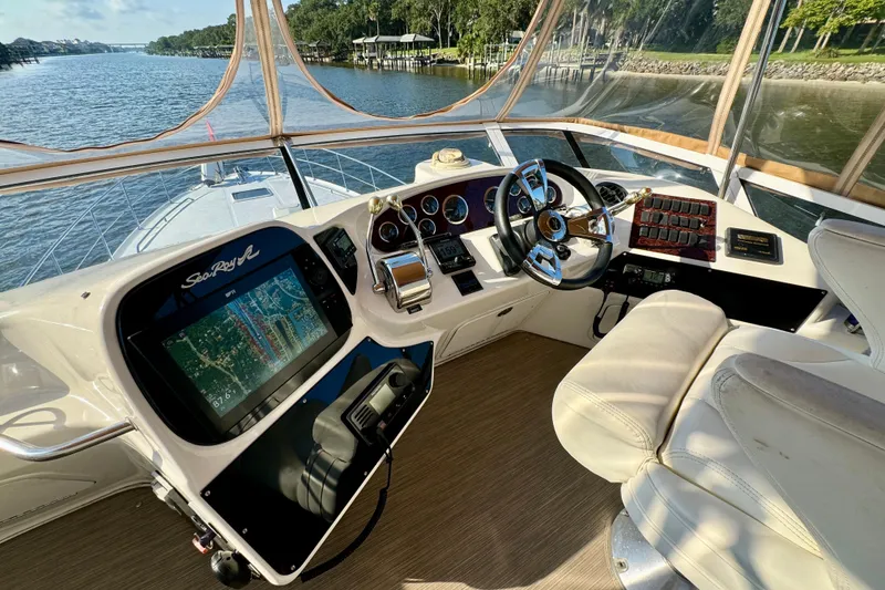 Slide: The Image of Cockpit of 2003 Sea Ray 400 Sedan Bridge with navigation system and steering wheel. - 42