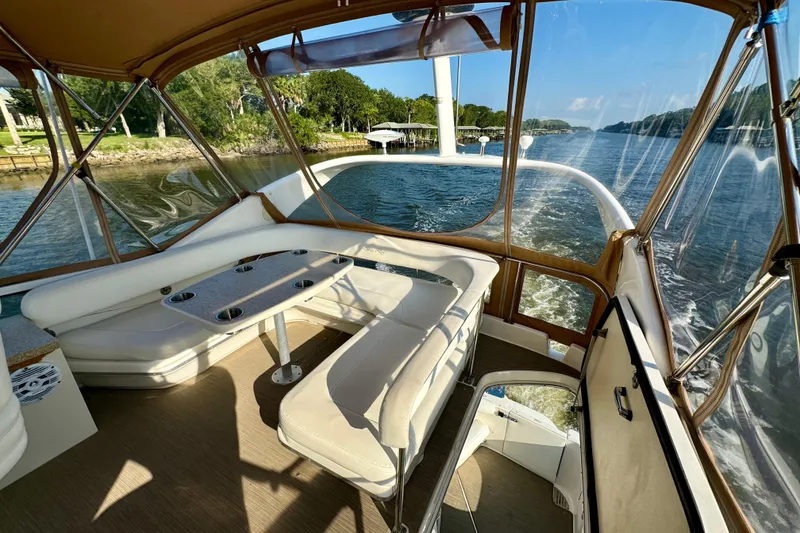 Slide: The Image of 2003 Sea Ray 400 Sedan Bridge interior with scenic waterway view. - 46