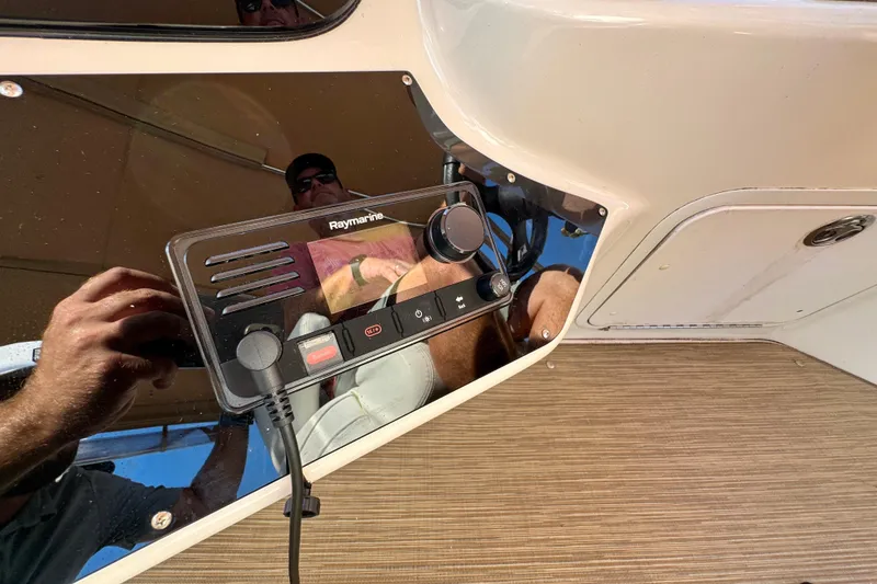 Slide: The Image of Raymarine control panel on 2003 Sea Ray 400 Sedan Bridge yacht dashboard. - 53