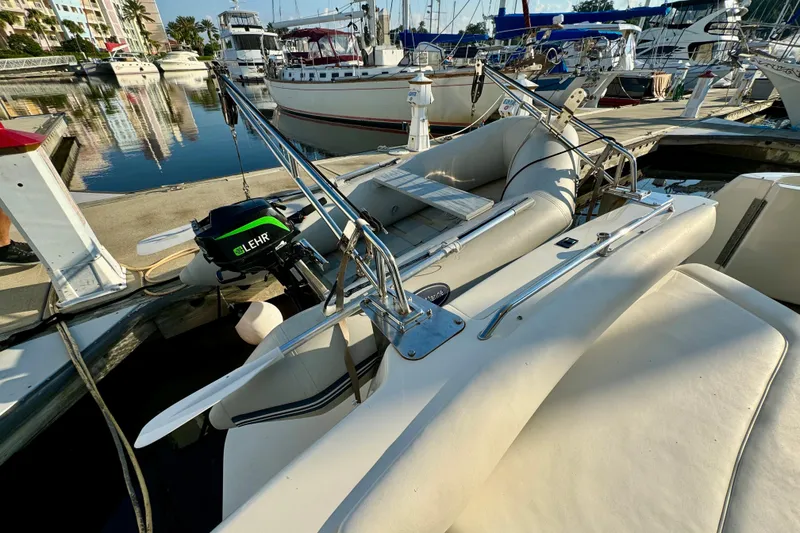 Slide: The Image of 2003 Sea Ray 400 Sedan Bridge docked with inflatable boat and Lehr motor. - 61