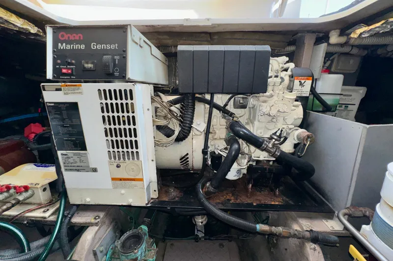 Slide: The Image of Onan marine generator in a 2003 Sea Ray 400 Sedan Bridge engine room. - 66