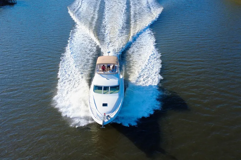 Slide: The Image of 2003 Sea Ray 400 Sedan Bridge cruising on open water, aerial view. - 8