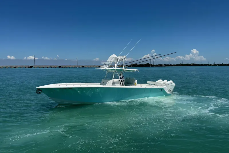 The Image of 2024 SeaVee 370z boat cruising on clear blue water under a sunny sky. - 0