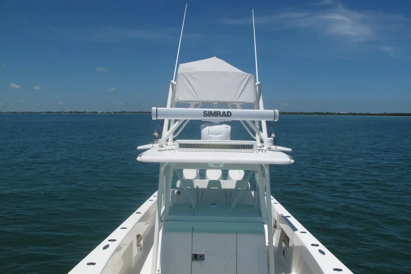 Slide: The Image of 2024 SeaVee 370z boat on calm ocean with clear blue sky. - 13