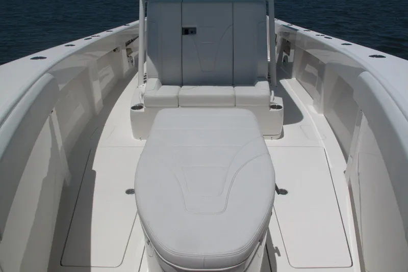 Slide: The Image of 2024 SeaVee 370z boat interior with white seating and spacious deck. - 14