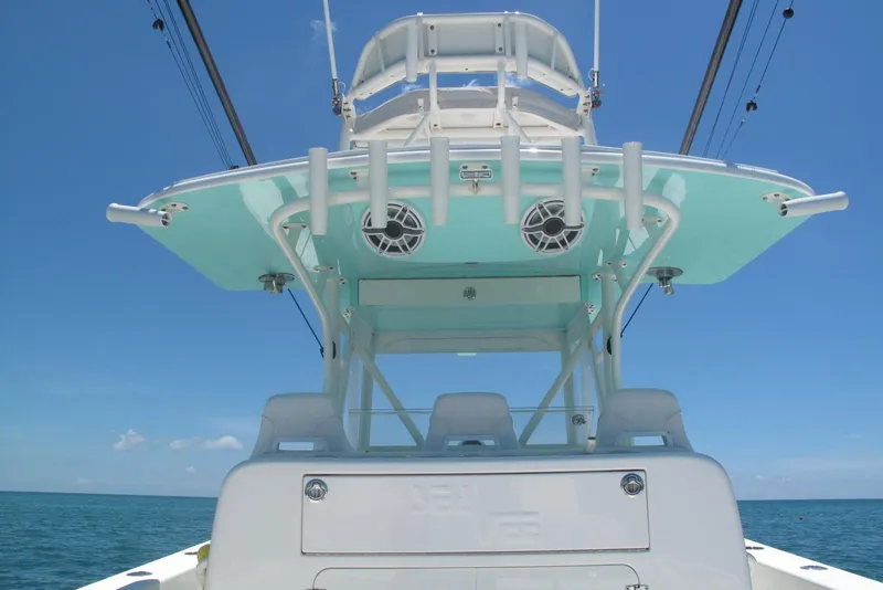 Slide: The Image of 2024 SeaVee 370z boat, featuring a sleek design and modern amenities, against a clear blue sky. - 15