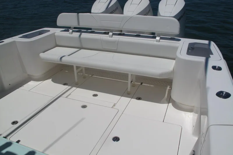 Slide: The Image of 2024 SeaVee 370z boat with spacious seating and triple outboard engines. - 17