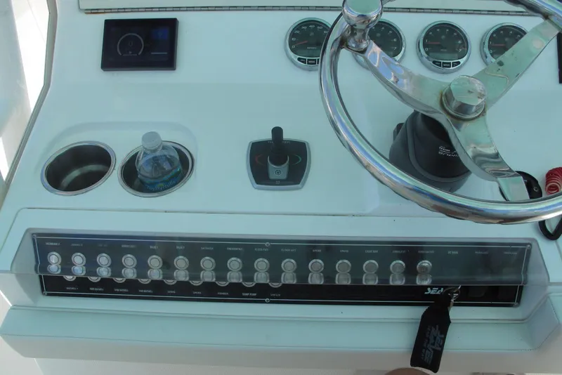 Slide: The Image of 2024 SeaVee 370z boat dashboard with steering wheel and control panel. - 6