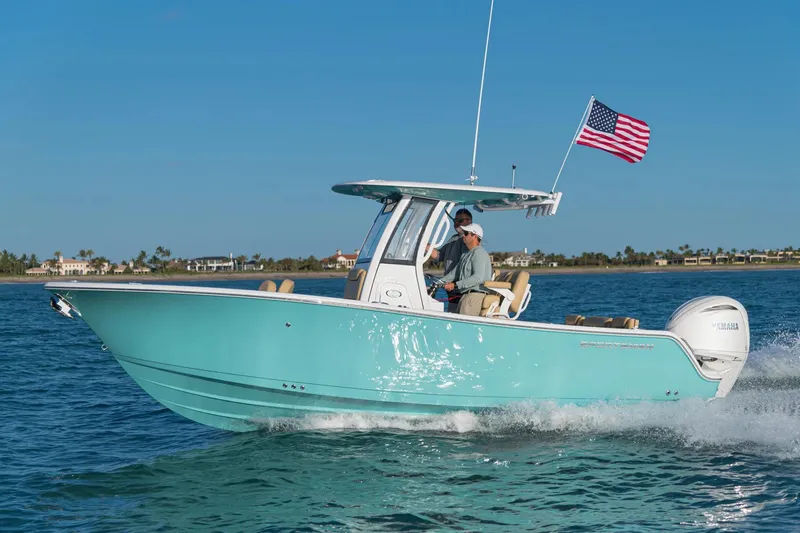 Slide: The Image of 2026 Sportsman Heritage 231 Center Console boat displayed indoors. - 0
