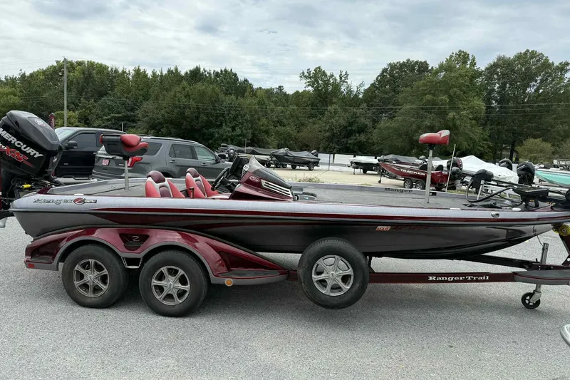 Slide: The Image of 2014 Ranger Z521 Comanche bass boat on trailer, parked outdoors. - 1