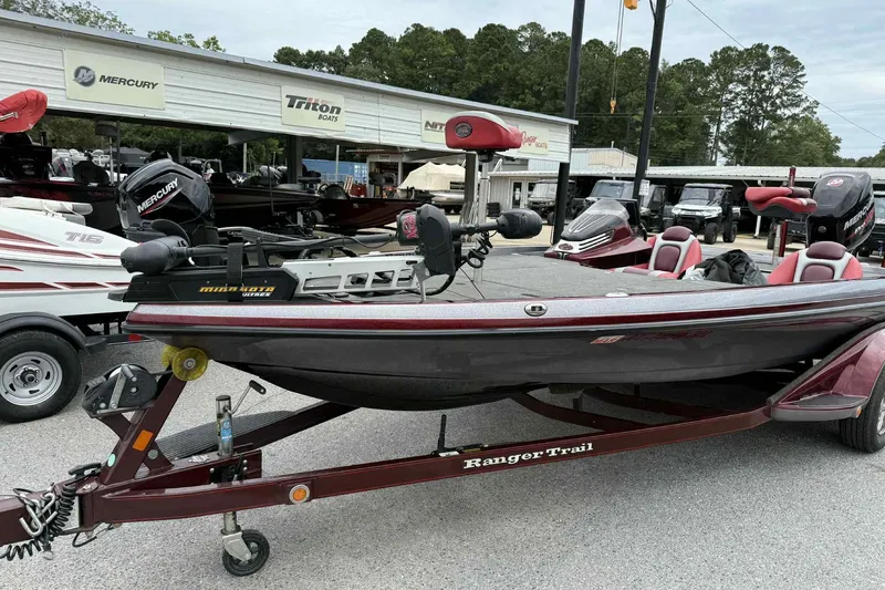 Slide: The Image of 2014 Ranger Z521 Comanche boat on trailer at dealership, featuring Mercury engine. - 3
