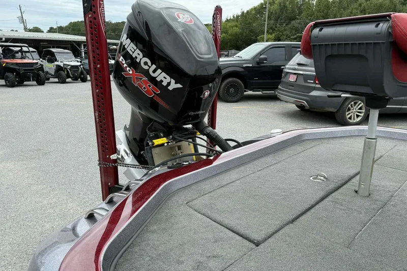 Slide: The Image of 2014 Ranger Z521 Comanche boat with Mercury Pro XS engine in parking lot. - 5