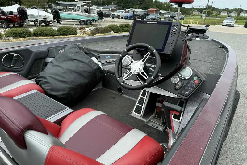 Slide: The Image of 2014 Ranger Z521 Comanche boat interior with steering wheel and control panel. - 6