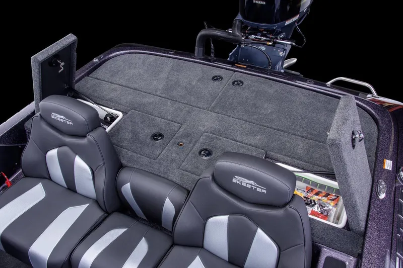 Slide: The Image of Manufacturer Provided Image: 2024 Skeeter ZX150 boat interior with cushioned seats and storage compartments. - 8